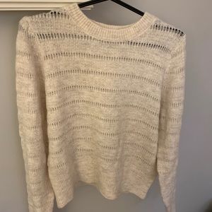 Cream colored sweater.